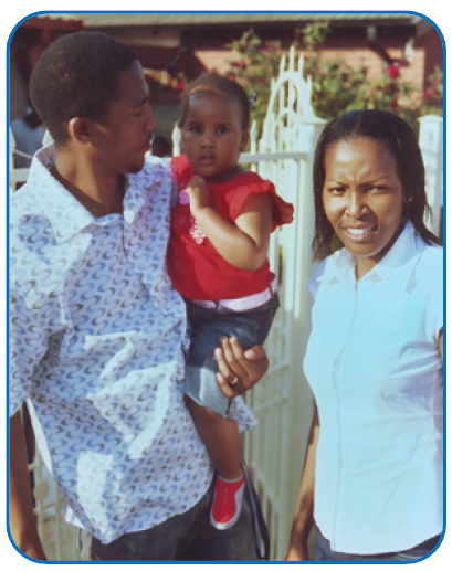 Tshiamo with her parents on her second birthday